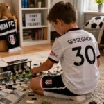 Fulham United home kids kit 26_27-over view-SESSEGNON 30-image